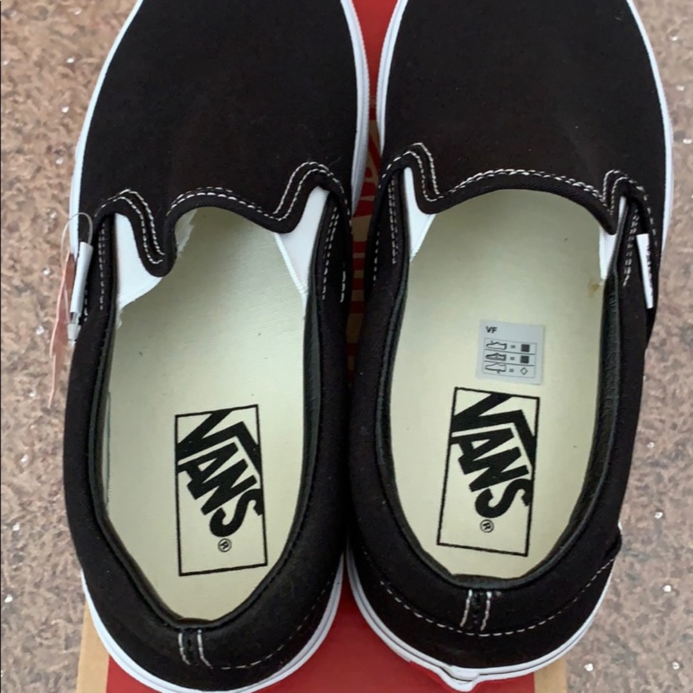 Vans all black slip ons. NEVER WORN. Box included